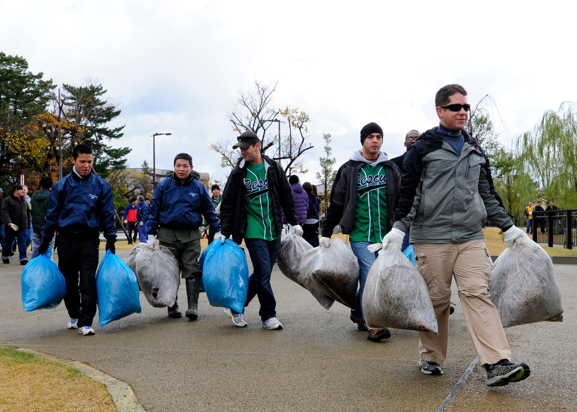 U.S. Air Force personnel from the 212th Rescue Squadron, 33rd RQS and 35th Fighter Wing teamed up with members from Japan Air Self-Defense Force and the Kinki-Chubu Defense Bureau in an effort to clean up a local park in Komastu, Japan, Nov. 15, 2014. The 35th FW from Misawa Air Base, Japan, was at Komatsu Air Base for an Aviation Training Relocation Program. The 33rd and 212th Rescue Squadrons were at Komatsu for exercise Keen Sword. The bilateral training conducted during exercise Keen Sword and in the ATR was to practice and evaluate the coordination procedures and interoperability elements required to effectively and mutually respond to the defense of Japan, or to a regional crisis in the Asia-Pacific region, while also building bilateral confidences and working relationships. (U.S. Air Force photo by 2nd Lt. Erik Anthony/Released)