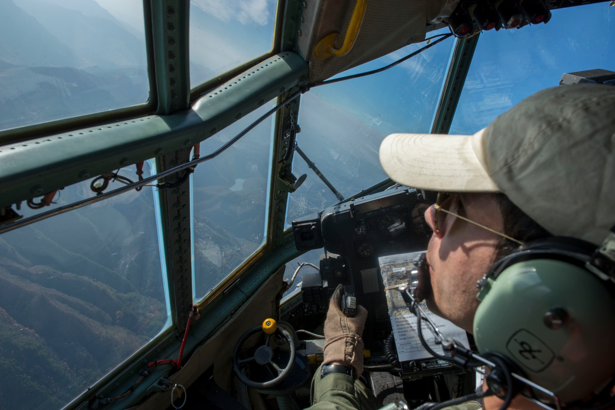 Capt. Shawn Hooton, 36 Airlift Squadron C-130 Hercules pilot, conducts a sharp left turn while participating in Exercise Max Thunder over South Korea Nov. 19, 2014. Max Thunder is a biannual bilateral exercise designed to strengthen U.S. and Republic of Korea partnership and interoperability. (U.S. Air Force photo by Staff Sgt. Cody H. Ramirez/Released)