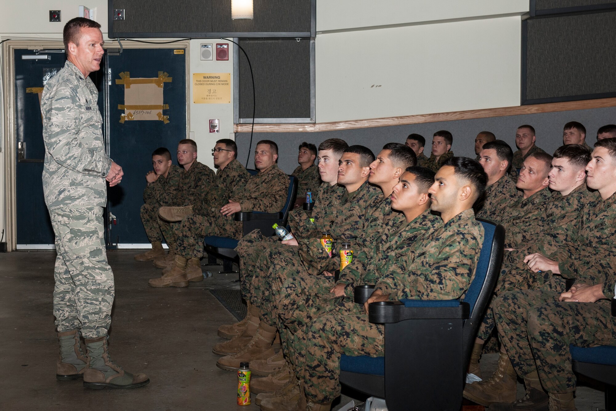 Col. Ken “Wolf” Ekman, 8th Fighter Wing commander, welcomes U.S. Marines arriving from Marine Corps Air Station Iwakuni, Japan, to Kunsan Air Base, Republic of Korea, Nov. 13, 2014. More than 1,000 personnel from various ROK air force units, the U.S. Navy, Marine Corps, Army and Air Force participated in Max Thunder 14-2, the largest biannual joint training exercise on the Korean Peninsula. (U.S. Air Force photo by Senior Airman Katrina Heikkinen/Released)