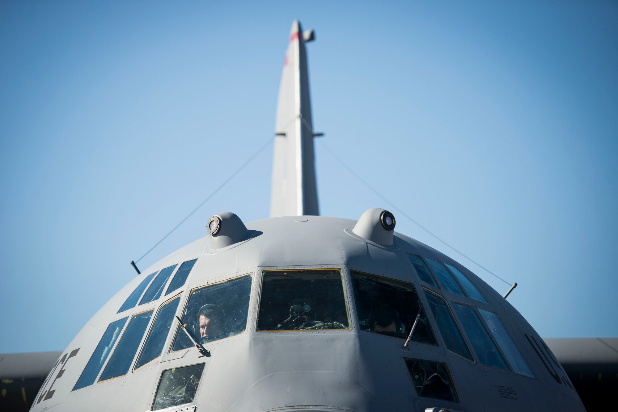 Lt. Col. Eric Gaulin and Capt. Shawn Hooton, C-130 Hercules pilots, conduct preflight checks at Yokota Air Base, Japan, during Exercise Max Thunder Nov. 19, 2014. Max Thunder is a biannual bilateral exercise designed to strengthen U.S.-Republic of Korea partnership and interoperability. (U.S. Air Force photo by Staff Sgt. Cody H. Ramirez/Released)