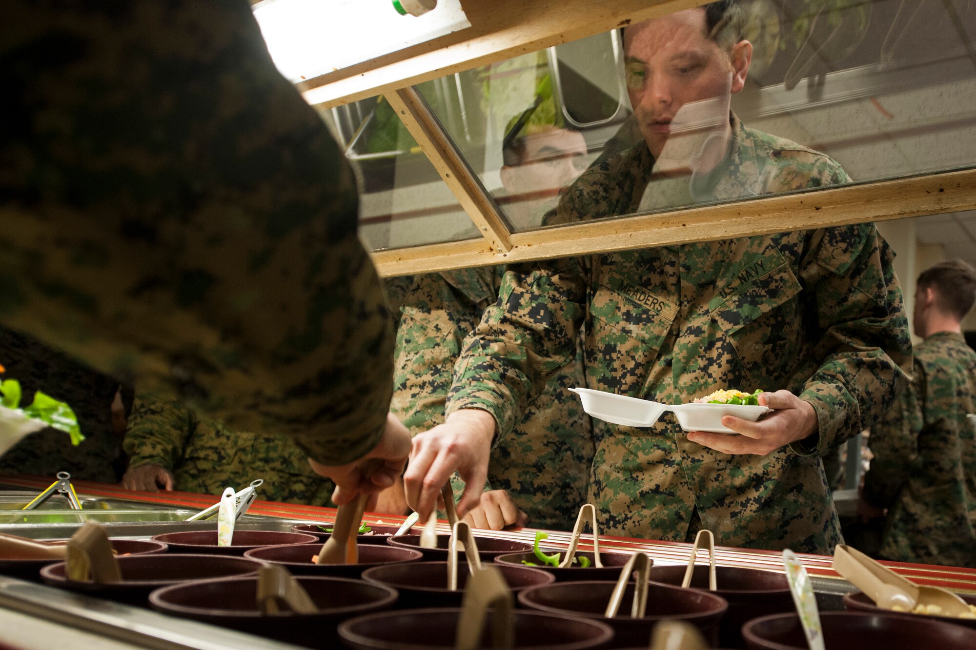 U.S. Navy sailors and Marines grab food to go at the O’Malley Dining Facility at Kunsan Air Base, Republic of Korea, Nov. 13, 2014. More than 1,000 personnel from various ROK air force units, the U.S. Navy, Marine Corps, Army and Air Force participated in Max Thunder 14-2, the largest biannual joint training exercise on the Korean Peninsula. (U.S. Air Force photo by Senior Airman Katrina Heikkinen/Released)