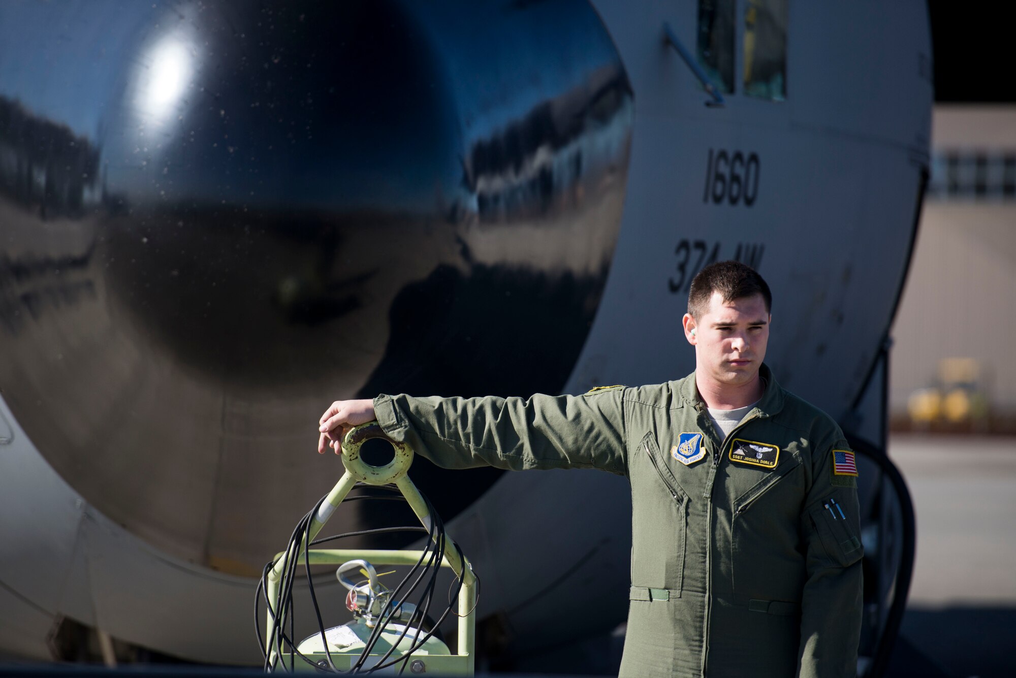 Staff Sgt. Joshua Doble, 36th Airlift Squadron flight engineer, waits to conduct preflight checks at Yokota Air Base, Japan, before taking part in Exercise Max Thunder Nov. 19, 2014. Max Thunder is a biannual exercise in South Korea that improves the interoperability of U.S. and Republic of Korea forces, and allows Team Yokota to train and prepare to respond to contingencies when called upon. (U.S. Air Force photo by Staff Sgt. Cody H. Ramirez/Released)