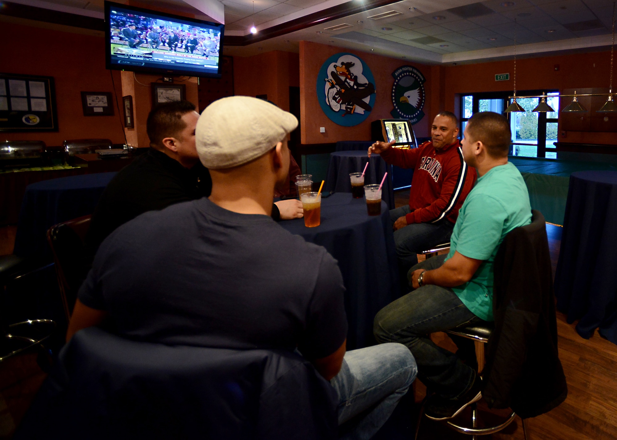 The Aviano’s Integral Men group watches football and chats during their inaugural event, Nov. 15, 2014, at Aviano Air Base, Italy. AIM is a new group tailored to husbands of active-duty service members. (U.S. Air Force photo/Staff Sgt. R.J. Biermann) 