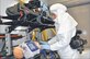 During a simulation, 2nd Lt. Ray Grothman monitors leads on an “Ebola patient” while wearing the Breathe Easy Powered Air Purifying Respirator around his waist. The respirator would help keep Grothman, or a medical technician, safe while treating the “patient” and is an example of equipment undergoing tests and evaluation by Air Force Life Cycle Management Center personnel in connection with the transport isolation system. (U.S. Air Force photo/John Scaggs)