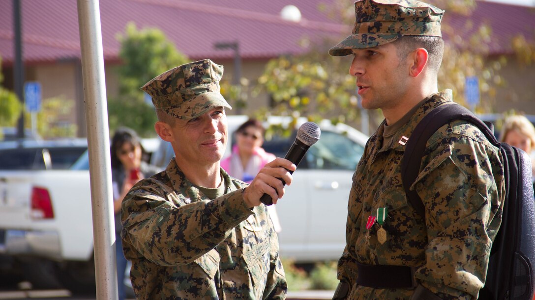 Captain Derek Herrera, right, a special operations officer with 1st Marine Special Operations Battalion, addresses family, friends and guests during a retirement ceremony aboard Camp Pendleton, Calif., Nov. 21. Herrera medically retired from the Marine Corps after eight years of service. He was also awarded the Bronze Star Medal with combat V for heroism for his actions in Helmand province, Afghanistan.