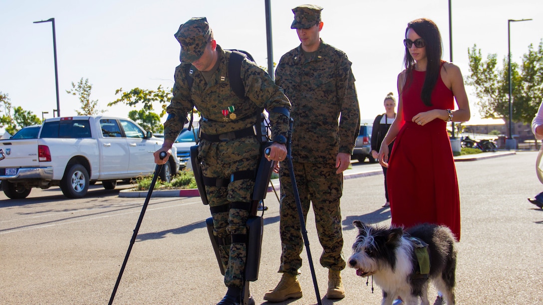 Captain Derek Herrera, left, a special operations officer with 1st Marine Special Operations Battalion, is accompanied by his wife, Maura, after a retirement ceremony aboard Camp Pendleton, Calif., Nov. 21. Herrera medically retired from the Marine Corps after eight years of service. He was also awarded the Bronze Star Medal with combat V for heroism for his actions in Helmand province, Afghanistan.