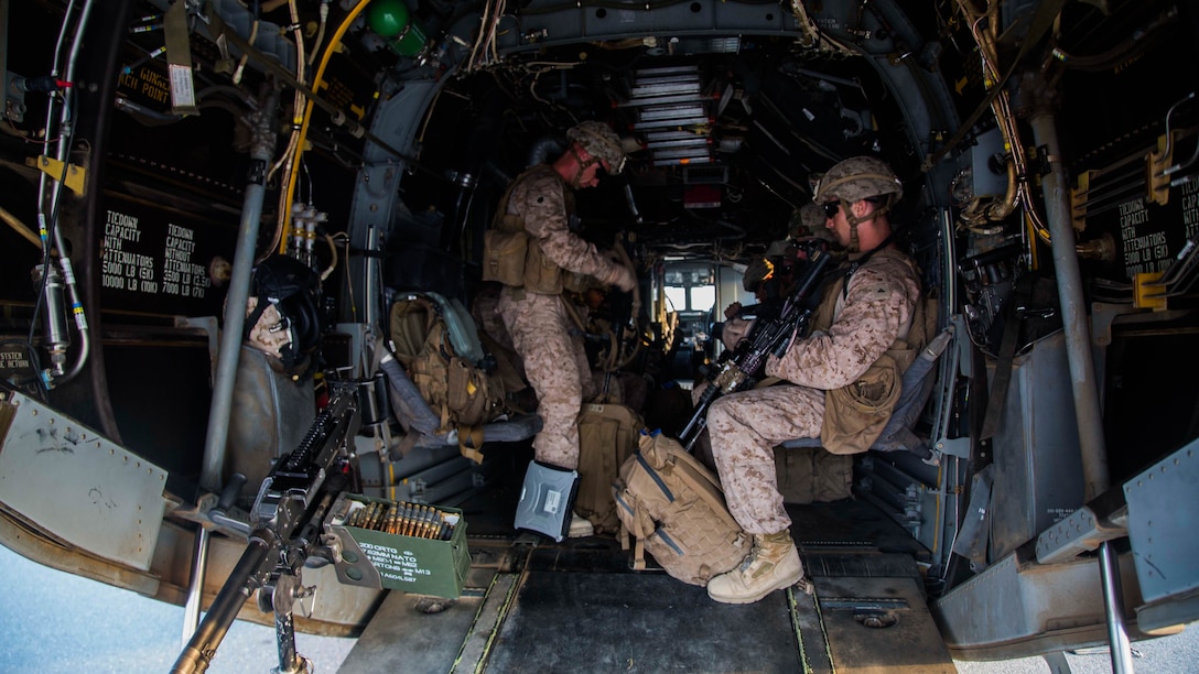 U.S. Marines with 2nd Battalion, 7th Marine Regiment, Special Purpose Marine Air Ground Task Force - Crisis Response - Central Command, strap into an MV-22B Osprey from Marine Medium Tiltrotor Squadron 363, SPMAGTF-CR-CC, during a Tactical Recovery of Aircraft and Personnel rehearsal drill in the U.S. Central Command area of operations, Oct. 25, 2014. The Marines and sailors of SPMAGTF-CR-CC serve as an expeditionary, crisis-response force tasked with supporting operations, contingencies and security cooperation in Marine Corps Forces Central Command and CENTCOM. 