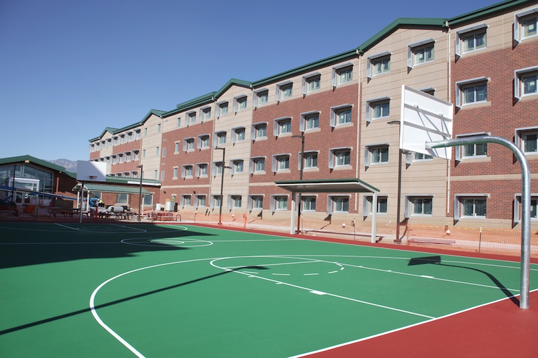 These barracks, located in Fort Carson, Colo., have been constructed in close proximity to Butts Army Airfield. The dorm-style buildings are comprised of 370,156 square feet, and are equipped with individual bathrooms and kitchenettes. The recreational areas situated behind the barracks buildings have facilities for sports, barbecuing, as well as indoor community recreation facilities.