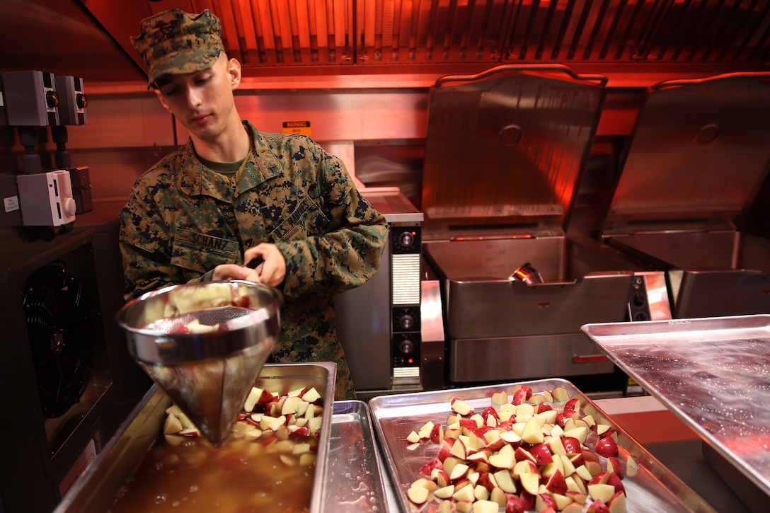 Lance Cpl. Patrick E. Schanz strains potatoes in preparation for a field mess meal for the W.P.T. Hill Award food service competition at Marine Corps Air Station Cherry Point, N.C., Nov. 18, 2014. Schanz is a food service specialist with Marine Wing Support Squadron 274 and a native of Austintown, Ohio.