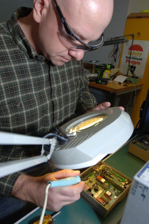 Henry Mare works on a soldering station Nov. 24, 2014 at the U.S. Army Corps of Engineers Nashville District Hydropower Branch's Electronics Service Section located at Old Hickory Dam in Hendersonville, Tenn.  Mare recently transitioned out of the U.S. Army at Fort Campbell, Ky., and has been working as an intern. The Corps recently selected him for a position as an electronics technician.