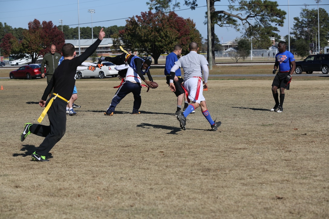 Marine and Sailors play flag football during the 2nd annual Turkey Bowl flag football tournament at Marine Corps Air Station Cherry Point, N.C., Nov. 21, 2014. During this year’s tournament, 11 teams played for bragging rights and the winner’s trophy. 150 Marines and Sailors participated in this year’s games. 
