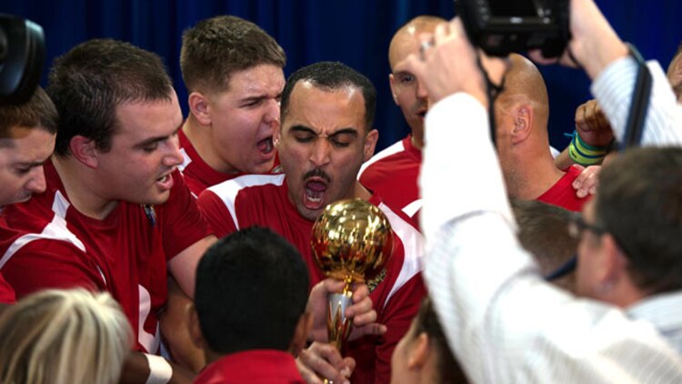 The Marine Corps sitting volleyball team celebrates their championship win after the 4th Annual Joint Services Sitting Volleyball Tournament in the Pentagon, Arlington, Va. on Nov. 20, 2014. The Marine Corps team took home the trophy winning the second match 25 to 23. The tournament was just one of many activities, which took place throughout the month. Every November since 2008, the Department of Defense and each branch of the armed forces promotes wounded warrior programs, activities and personal feats of recovery through Warrior Care Month. 