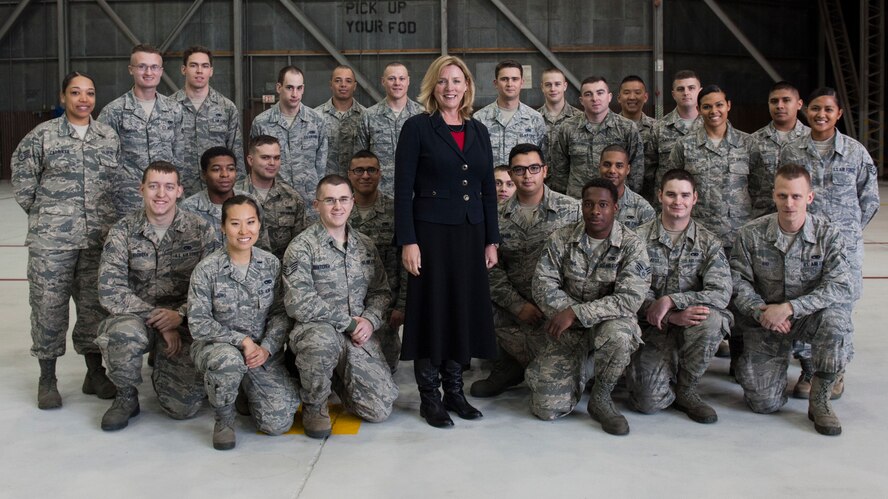 Secretary of the Air Force Deborah Lee James poses with 8th Aircraft Maintenance Squadron Airmen during her first tour of Kunsan Air Base, Republic of Korea, Nov. 22, 2014. James spent time at Kunsan as part of her visit to Pacific Command bases to meet with Airmen and understand their mission. (U.S. Air Force photo by Senior Airman Katrina Heikkinen/Released) 