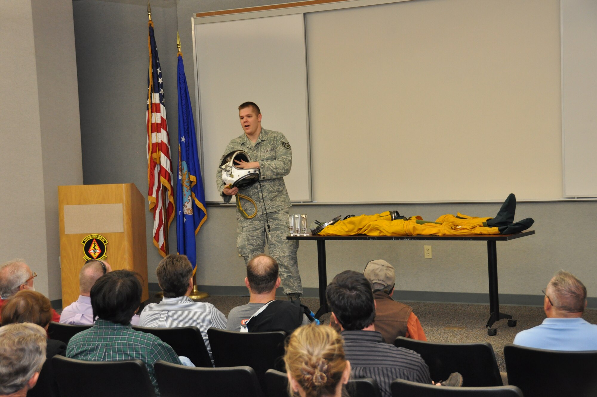 Staff Sgt. J. Thorpe, a 9th Physiological Support Squadron member, briefs local area business leaders on the high-altitude full pressure suit designed to protect U-2 Dragon lady pilots from hypoxia, a condition affecting the whole body or a localized region while the body is in a low-oxygen environment. When people experience altitude sickness they may feel nausea, fatigue, light headedness, and vision changes and other symptoms may occur. The suit also protects pilots when they fly above Armstrong’s line or over 62,000 feet. Without the suit a pilot’s blood would boil at that altitude if the plane depressurized. (U.S. Air Force photo by Tech. Sgt. Heather Skinkle/Released)