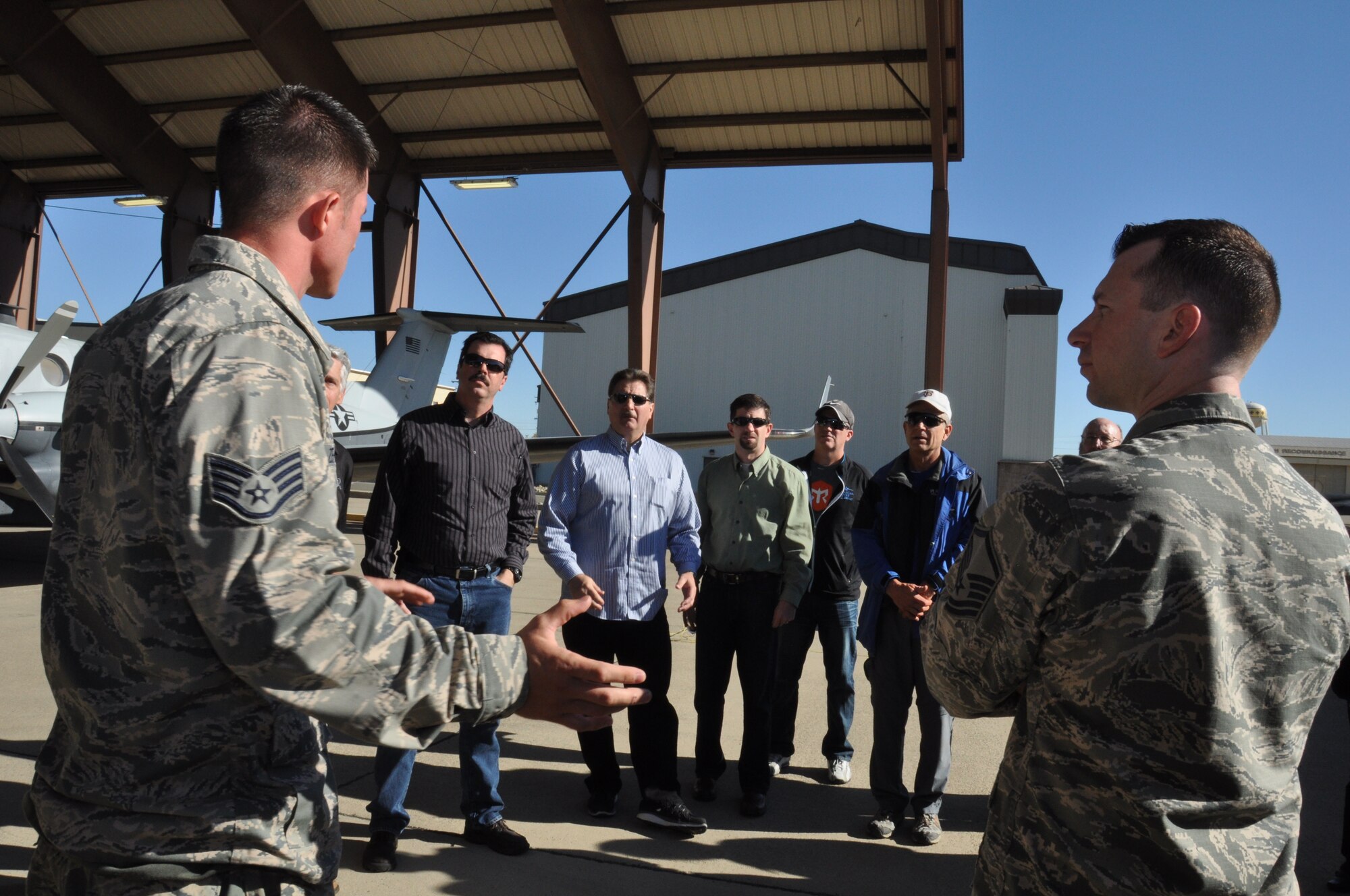 Briefers explain Beale Air Force Base’s various aircraft missions during a base tour for local civic leaders, Nov. 7, Beale Air Force Base, Calif.  Aircraft flown at the base include the U-2 Dragon Lady, RQ-4 Global Hawk, MC-12W, and the T-38 Talon. (U.S. Air Force photo by Tech. Sgt. Heather Skinkle/Released)