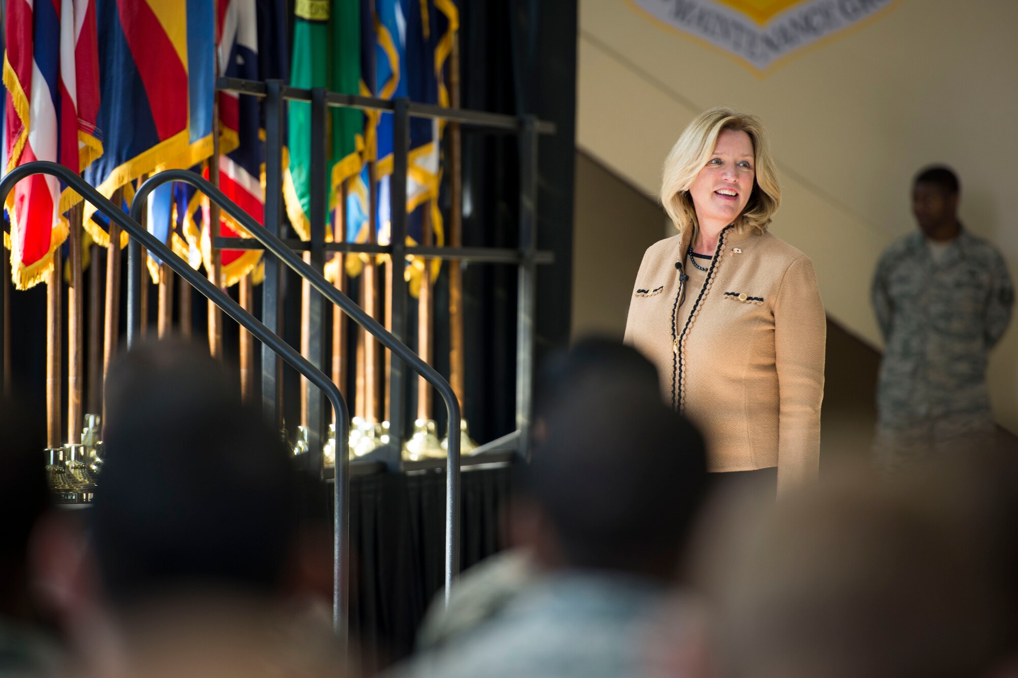Secretary of the Air Force Deborah Lee James looks to the crowd before speaking to Airmen at Yokota Air Base, Japan, Nov. 21, 2014. James had multiple stops on her trip before coming to Japan, and will continue her journey throughout the Pacific after leaving Yokota. (U.S. Air Force photo by Staff Sgt. Cody H. Ramirez/Released)