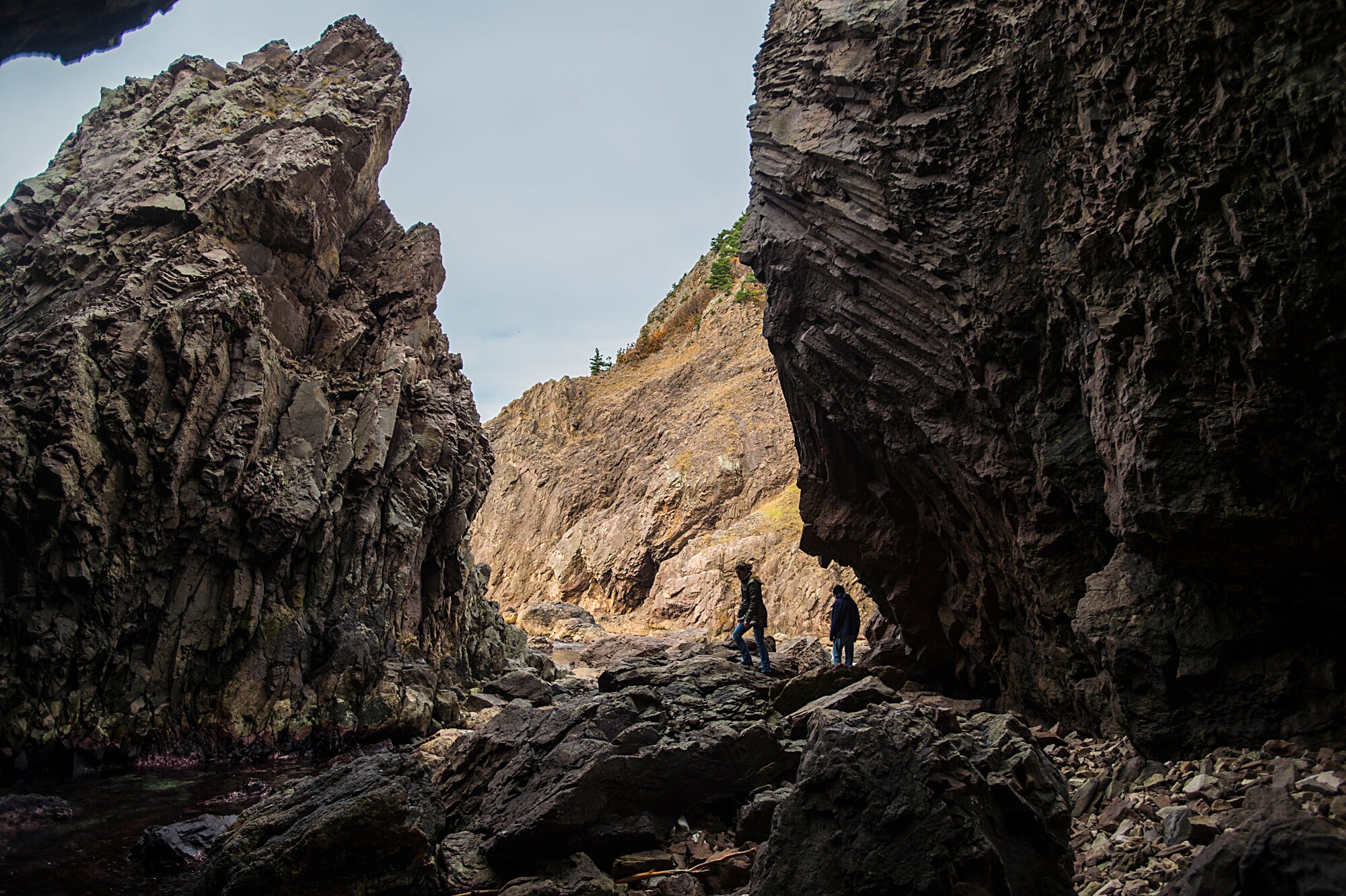 Tourists explore large rock masses surrounding the coastline near the Sai Buddhist Prayer Park nearby Route 338 Japan, Nov. 14, 2014. (U.S. Air Force photo by Tech. Sgt. Araceli Alarcon/Released)