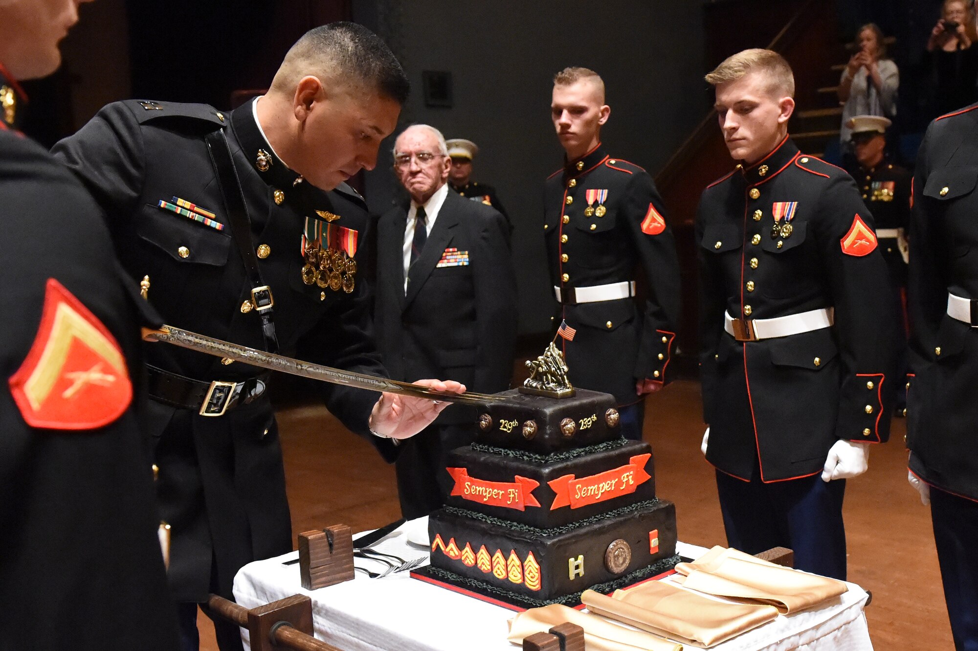 Capt. David Rubio, Company A, Marine Cryptologic Support Battalion commanding officer, cuts the cake during the Marine Corps Birthday Ball Nov. 15, 2014, at the Sherman Street Event Center, Denver. The ball was held in honor of the Marine Corps’ 239th birthday, complete with a guest speaker, dinner and dancing. (U.S. Air Force photo by Airman 1st Class Samantha Saulsbury/Released)