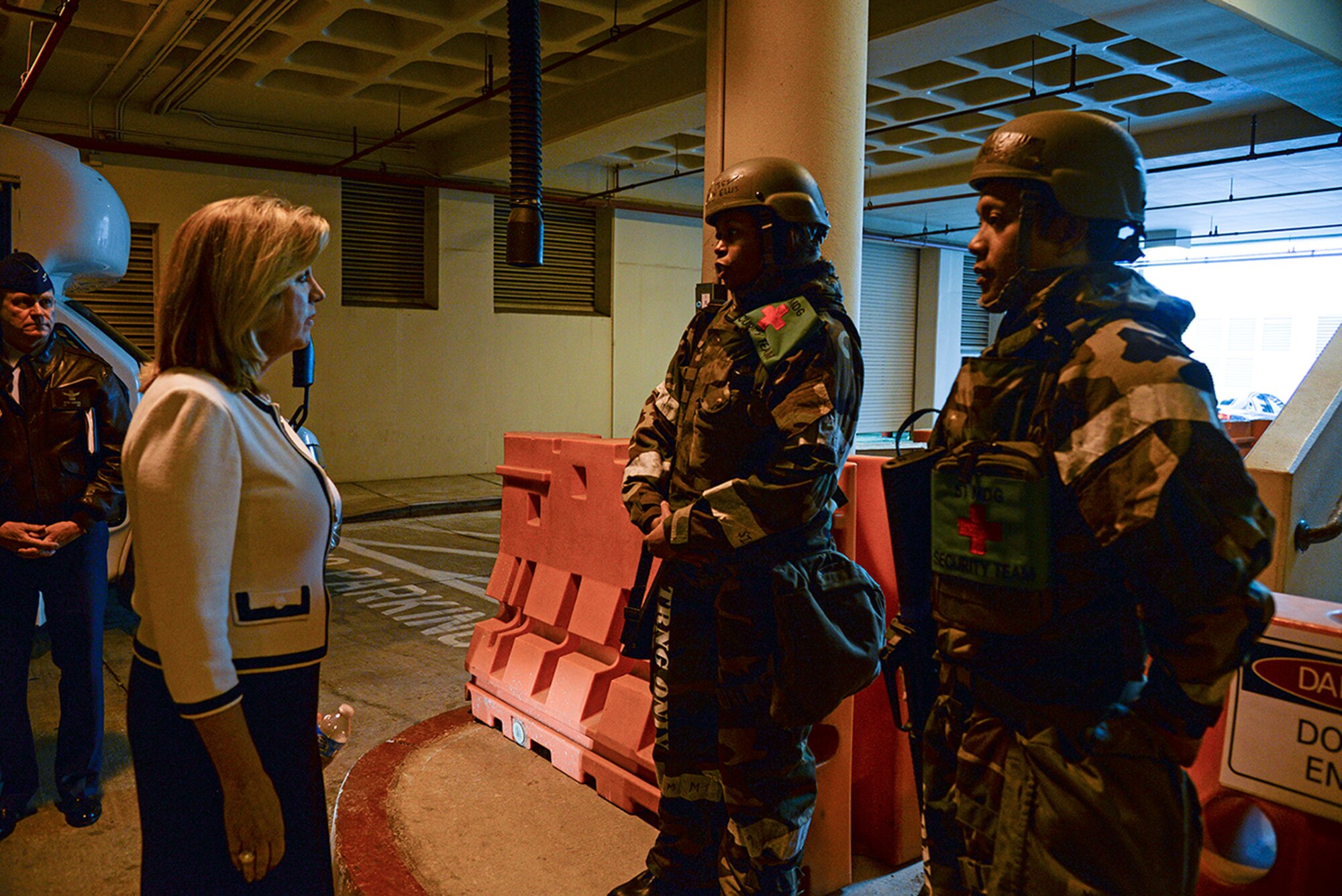 Secretary of the Air Force Deborah Lee James receives a combat medical briefing from Tech. Sgt. Carmen Ellis outside the emergency entrance to the 51st Medical Group Nov. 24, 2014, at Osan Air Base, Republic of Korea. James learned about the dual mission of the 51st MDG, which includes serving families as well as ensuring Airmen maintain medical readiness in a potentially emergency environment. 