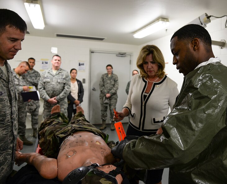 Secretary of the Air Force Deborah Lee James learns how to decontaminate a simulated patient from Tech. Sgt. Destin Huey, a 51st Aerospace Medicine Squadron optometry technician, at the 51st Medical Group Nov. 24, 2014, at Osan Air Base, Republic of Korea. James toured the 51st MDG as part of her visit to Osan AB, learning about the base’s unique medical mission of serving both families and Airmen in a contingency environment. (U.S. Air Force photo by Staff Sgt. Jake Barreiro)
