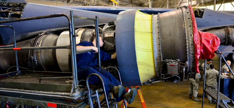 Senior Airman Adam Casillas, 2nd Maintenance Squadron aerospace propulsion journeyman, replaces a B-52H Stratofortress engine turnbuckle on Barksdale Air Force Base, La., Nov. 24, 2014. Turnbuckles are used to hold the internal part of the engine together with exterior parts.(U.S. Air Force photo/Airman 1st Class Mozer O. Da Cunha) 