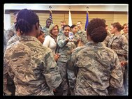 Secretary of the Air Force Deborah Lee James takes selfies with Airmen at the Ginko Tree Dining Facility Nov. 24, 2014, at Osan Air Base, Republic of Korea. James met and talked with Airmen on her trip to Osan as part of her 11-day visit to the Pacific region. (U.S. Air Force photo by Staff Sgt. Jake Barreiro)