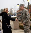 Secretary of the Air Force Deborah Lee James greets Lt. Col. Charles St. Stauver, 51st Force Support Squadron commander, outside the Ginko Tree Dining Facility Nov. 24, 2014, at Osan Air Base, Republic of Korea. James visited Osan Air Base as part of an 11-day trip to the Pacific region. During her visit she received a brief on the 51st FW’s mission and talked with base Airmen at an all call. (U.S. Air Force photo by Staff Sgt. Jake Barreiro)