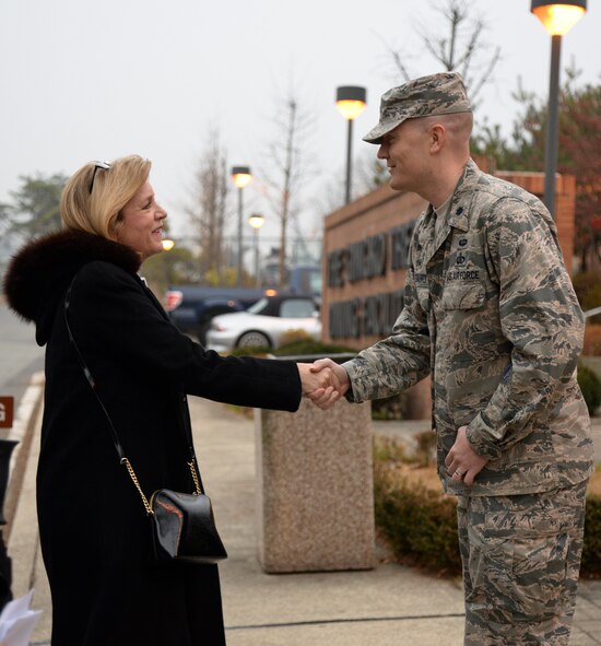 Secretary of the Air Force Deborah Lee James greets Lt. Col. Charles St. Stauver, 51st Force Support Squadron commander, outside the Ginko Tree Dining Facility Nov. 24, 2014, at Osan Air Base, Republic of Korea. James visited Osan Air Base as part of an 11-day trip to the Pacific region. During her visit she received a brief on the 51st FW’s mission and talked with base Airmen at an all call. (U.S. Air Force photo by Staff Sgt. Jake Barreiro)