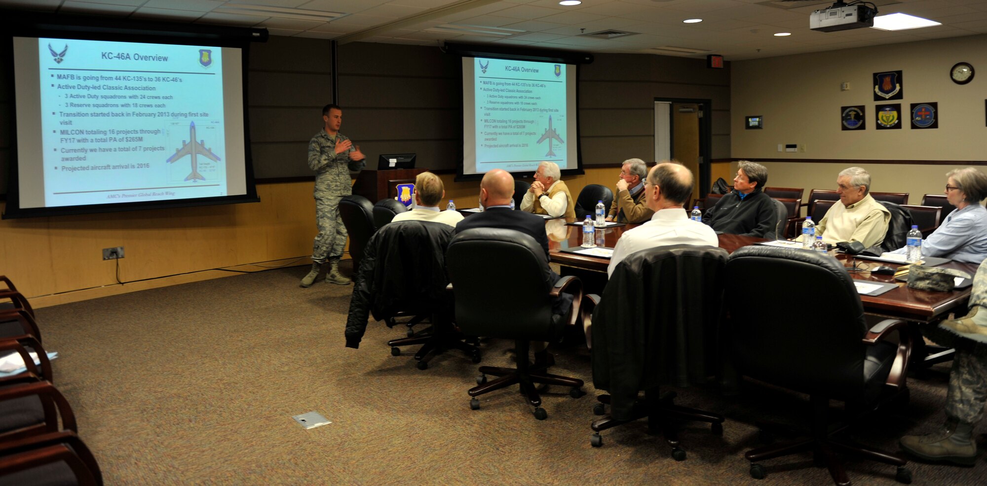 First Lt. Daniel Calvario, KC-46 Program Integration Office lead civil engineer, briefs civic leaders on the progress of the ongoing construction in preparation of the arrival of the KC-46A Pegasus, Nov. 18, 2014. (U.S. Air Force photo/Tyler Grimes)