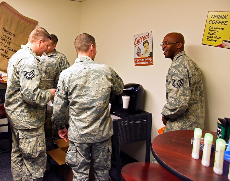 Team Malmstrom members enjoy each other’s company while grabbing a free cup of coffee in the newly implemented Holy Joe’s Café Nov. 20.  In addition to coffee, various organizations have started to send care packages to the coffee shop for Airmen. The care packages are completely free of charge and provide a variety of the basic essentials Airmen need while deployed to the field. (U.S. Air Force photo/ Airman 1st Class Collin Schmidt)