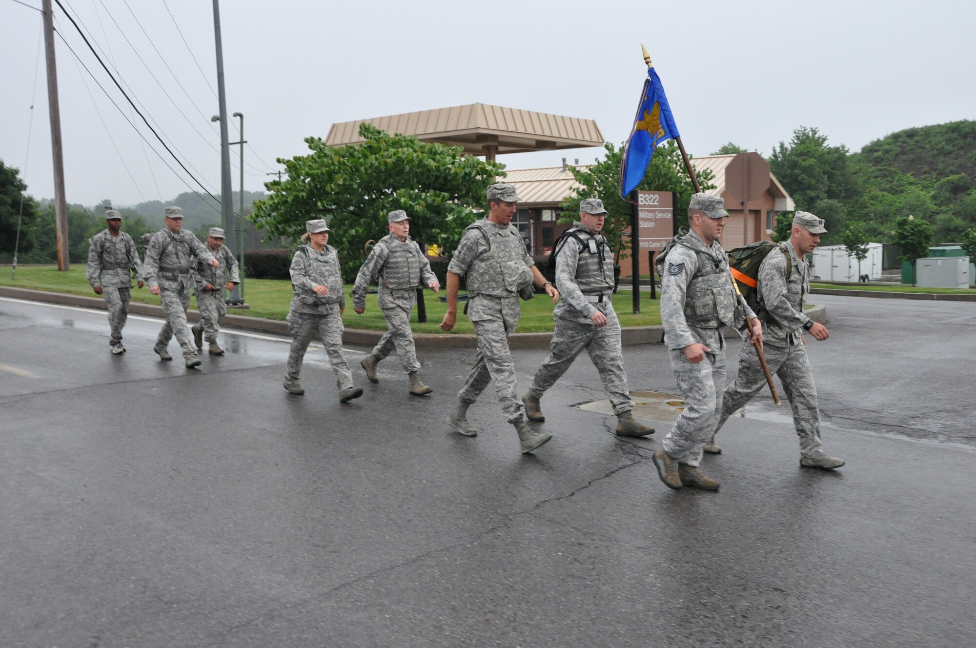 Capt. Nick Megyesi, right, operations officer with the 911th Security Forces Squadron, marches with several other members of security forces and the 911th Airlift Wing June 19, 2014. The security forces commander’s support staff conducts physical training twice weekly where participants come from all over the base participate. 