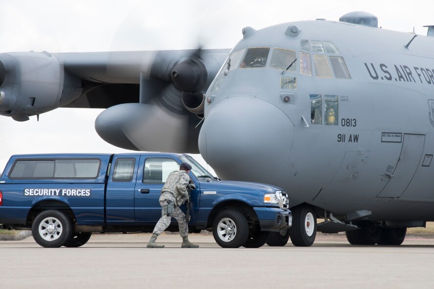 PITTSBURGH INTERNATIONAL AIRPORT AIR RESERVE STATION, Pa. – Staff Sgt. Judson Heckerman, 911th Security Forces, parks in front of a C-130 Hercules during a hijacking exercise Nov. 24 here.  As part of the exercise, Heckerman was initially unaware of the hijacking until he noticed specific signals from the crew that the aircraft had been taken over . (U.S. Air Force photo by Jacob Morgan)