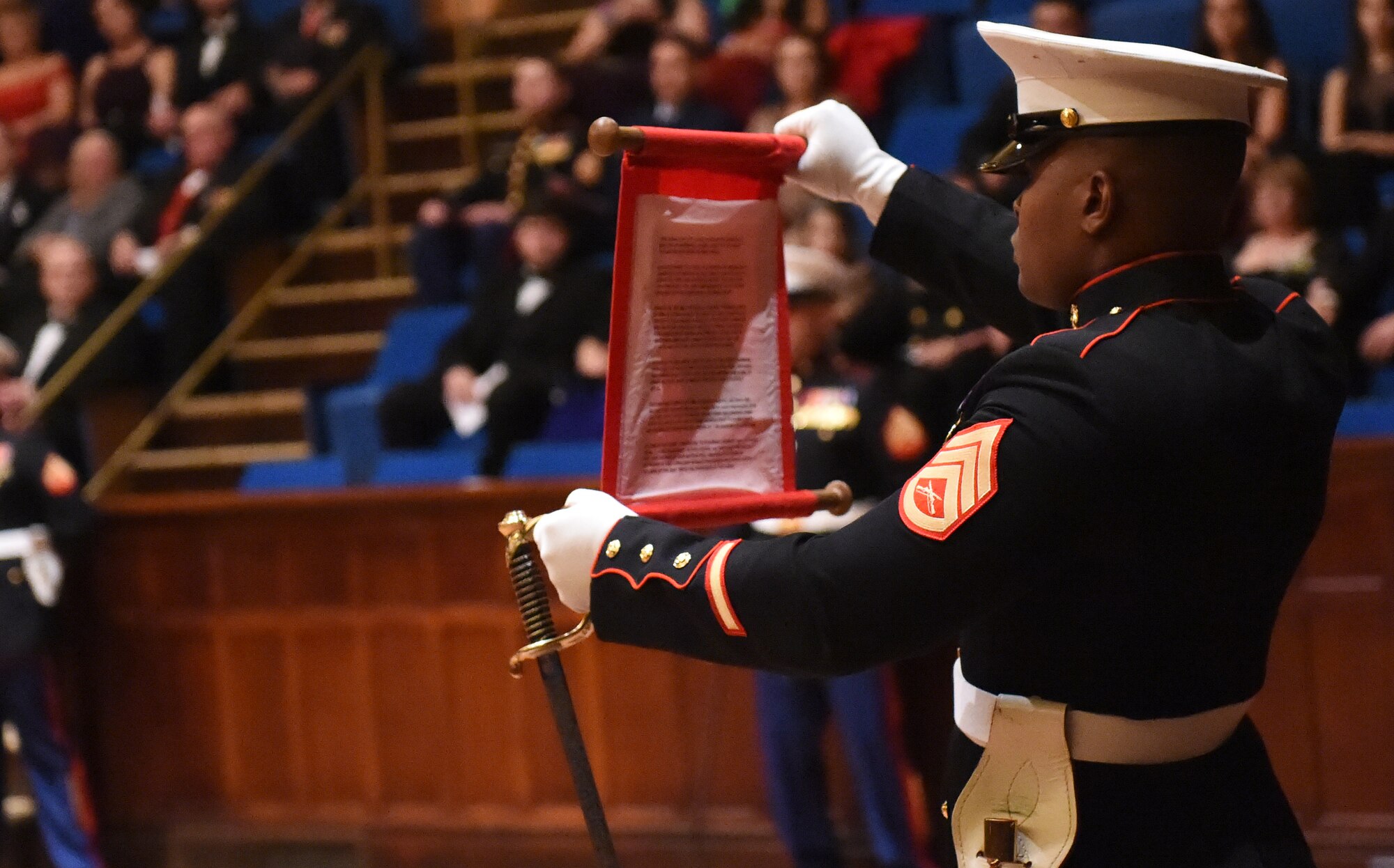 A member of the Company A, Marine Cryptologic Support Battalion reads Lt. Gen. John Lejeune’s birthday message during the Marine Corps birthday ball Nov. 15, 2014, at the Sherman Street Event Center, Denver. Lejeune, 13th Commandant of the U.S. Marine Corps, ordered the message be read every year during the Marine Corps birthday to honor the history, mission and tradition of the Corps. (U.S. Air Force photo by Airman 1st Class Samantha Saulsbury/Released)