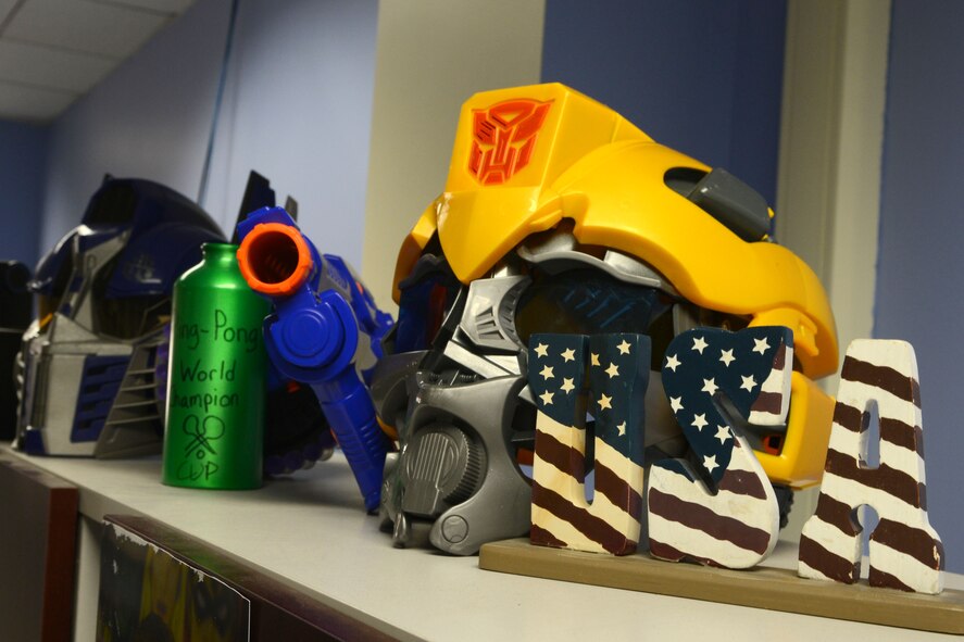 A shelf displays morale boosting ornaments at Shaw Air Force Base, S.C., Nov. 24, 2014. Morale and teamwork are very important for Airmen in order to maintain healthy working relationships. (U.S. Air Force photo by Senior Airman Ashley L. Gardner/Released)