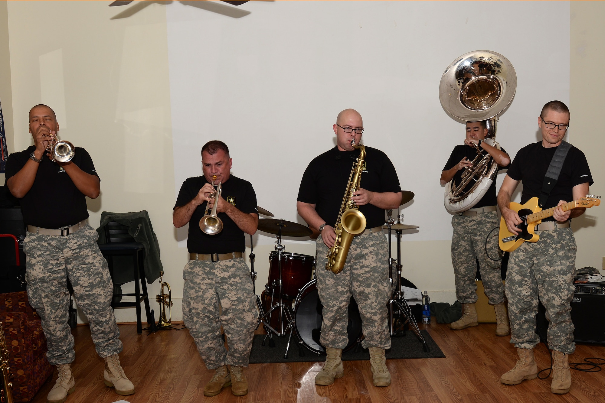 The U.S. Army Training and Doctrine Command Band performs holiday music during the fourth annual Thanks for Giving potluck social at the Lakeside Grill at Fort Eustis, Va., Nov. 20, 2014. The band performed to provide entertainment and moral support for families who have lost a family member during their military service. (U.S. Air Force photo by Staff Sgt. Teresa J. Cleveland/Released)