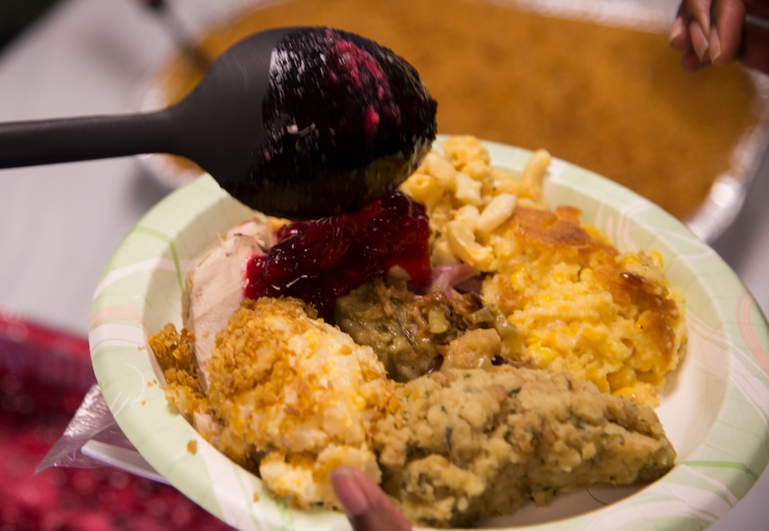 Team Moody leadership helps serve Airmen a meal during a Thanksgiving lunch Nov. 20, 2014, at Moody Air Force Base, Ga. The yearly event is designed to ensure young Airmen get a home-cooked meal during the holidays. (U.S. Air Force photo by Senior Airman Sandra Marrero/Released)
