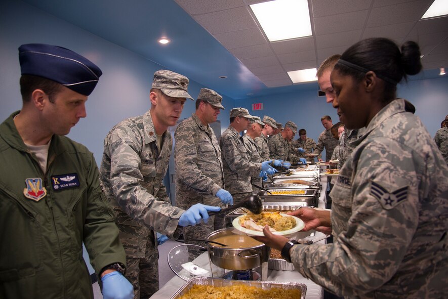 Team Moody leadership helps serve Airmen a meal during a Thanksgiving lunch Nov. 20, 2014, at Moody Air Force Base, Ga. The yearly event is designed to ensure young Airmen get a home-cooked meal during the holidays. (U.S. Air Force photo by Senior Airman Sandra Marrero/Released)
