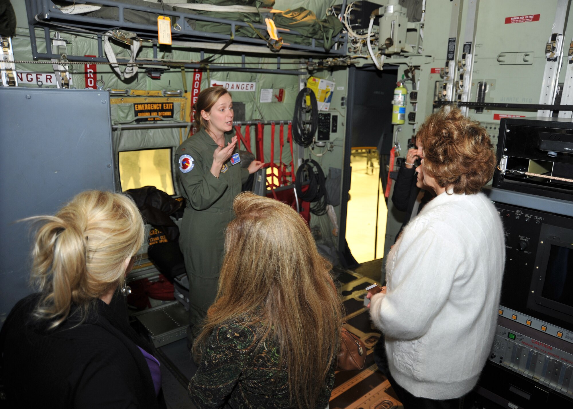 2nd Lt. Leesa Froelich, 53rd Weather Reconnaissance Squadron aerial reconnaissance weather officer, briefs several Keesler Spouse’s Club members about the mission of the Hurricane Hunters during a tour Nov. 18, 2014, at Keesler Air Force Base, Mississippi. The 53rd WRS is assigned to the 403rd Wing, an Air Force Reserve Command unit. (U.S. Air Force photo/Maj. Marnee A.C. Losurdo)