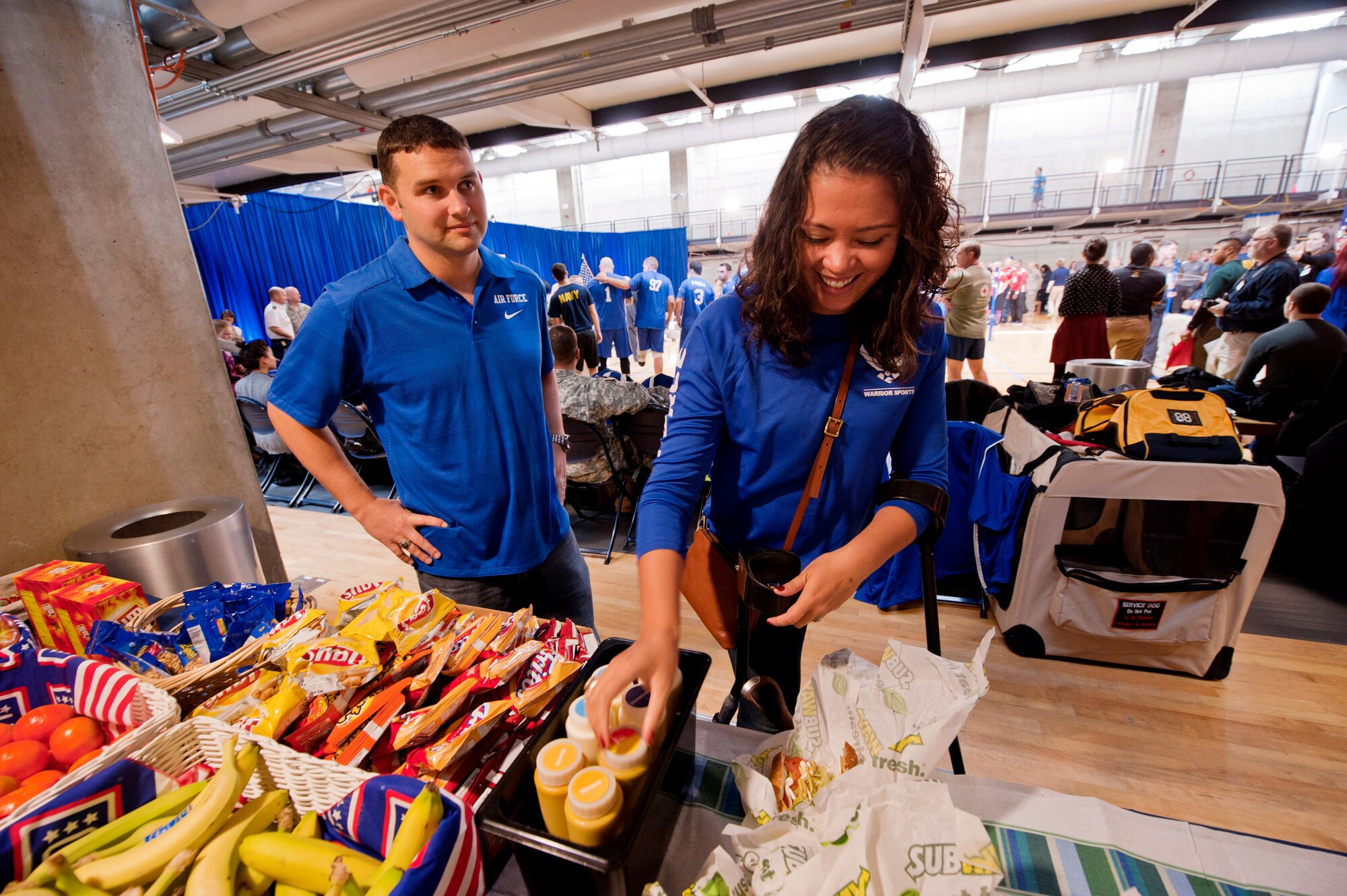 Retired Air Force Capt. Sarah Evans and her husband, Joe, take part in a free lunch provided by the USO during the 4th Annual Pentagon Sitting Volleyball Tournament on Nov. 20, 2014, at the Pentagon Athletic Club. The USO is dedicated to helping in the rehabilitation and reintegration of our troops as they and their families navigate the road to recovery. (U.S. Air Force photo/Staff Sgt. Anthony Nelson Jr.)

