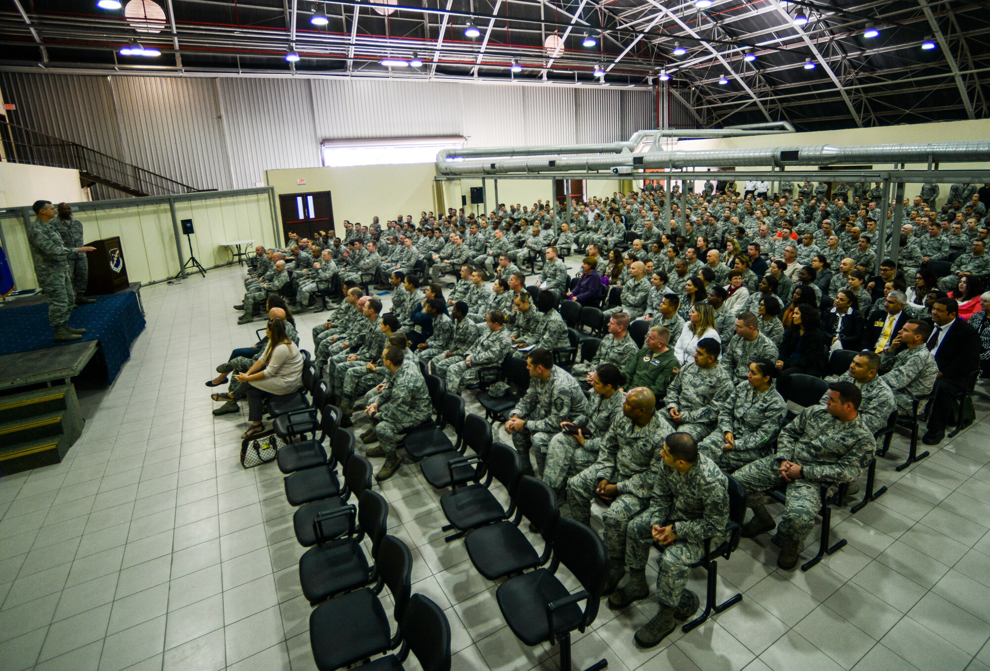 39th Air Base Wing Airmen gather to hear results of the recent unit effectiveness inspection, Nov. 24, 2014, Incirlik Air Base, Turkey. The wing garnered 10 strengths and highly effective ratings in two of the four grading areas. (U.S. Air Force photo by Airman Cory W. Bush/Released)