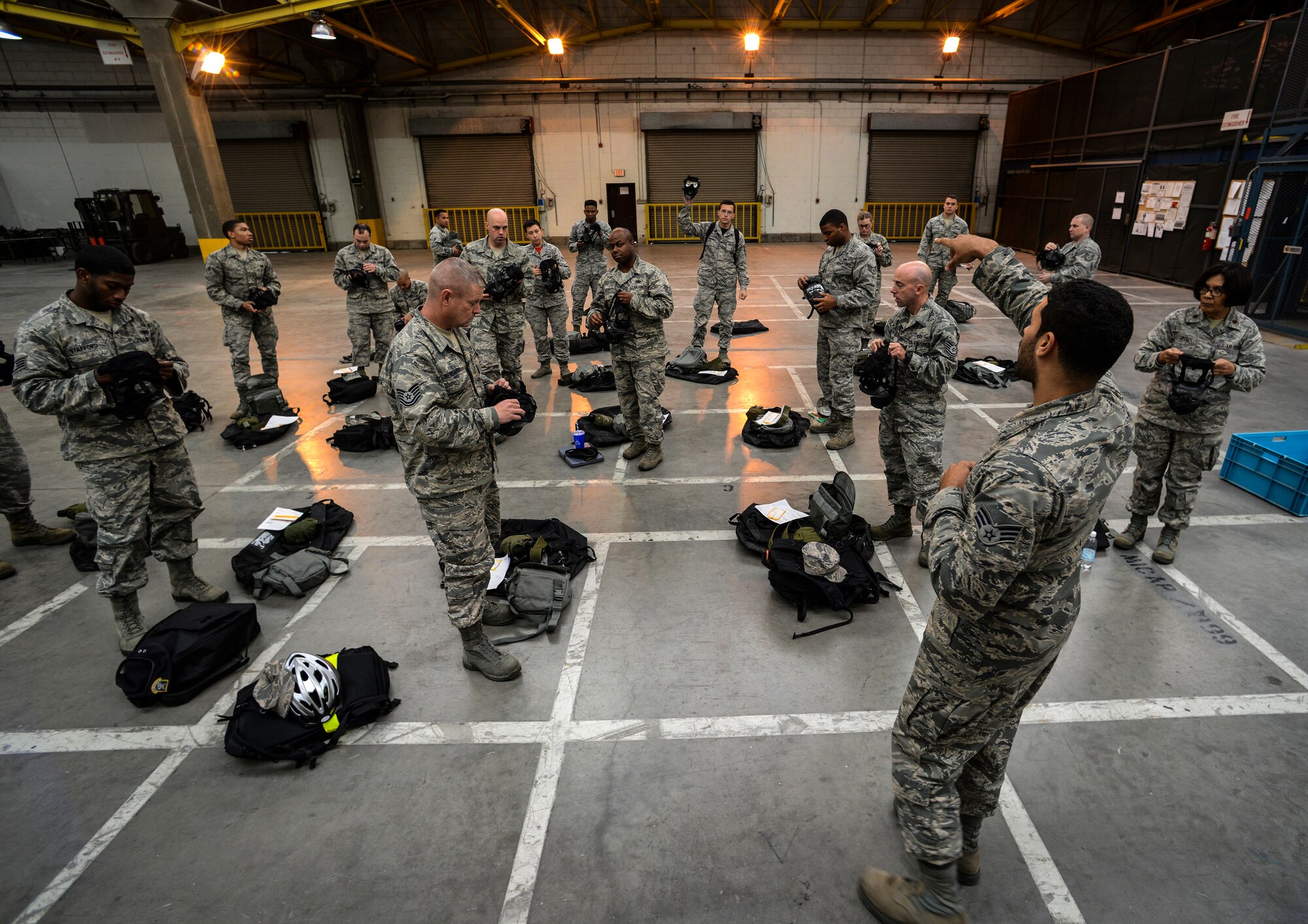 Senior Airman Jean-Pearce Jenkins, 39th Logistics Readiness Squadron mobility journeyman, guides Airmen through their individual protection equipment bag issue Nov. 21, 2014, at Incirlik Air Base, Turkey. The 39th LRS is comprised of logistics warriors ready to fight and aggressively enable others to fight. (U.S. Air Force photo Airman by Cory W. Bush/Released)