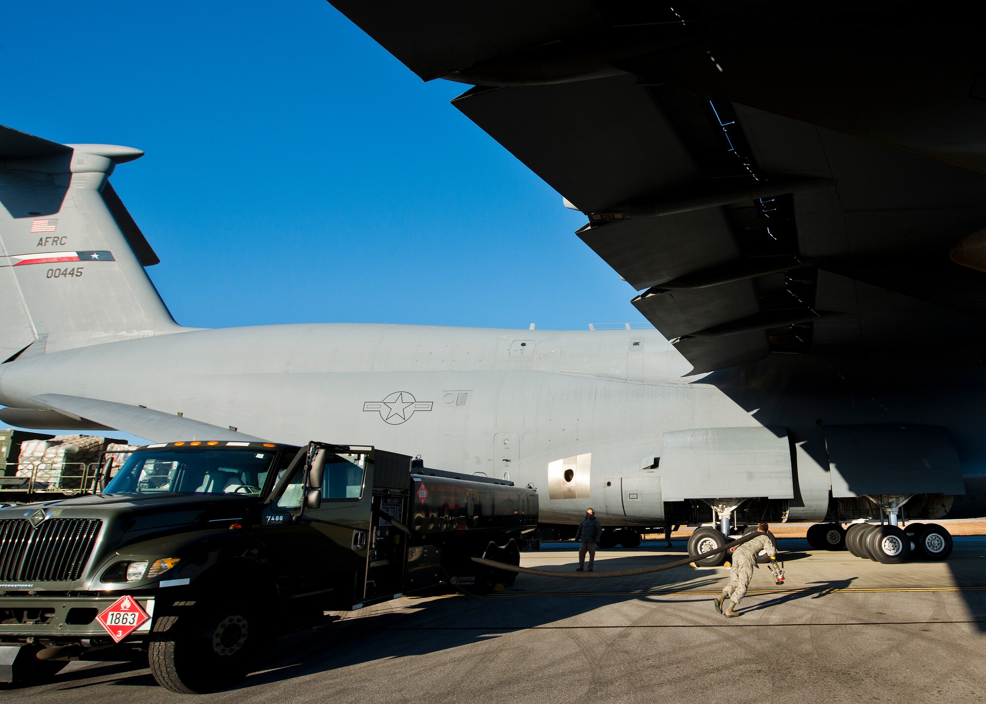 A 96th Logistics Readiness Squadron Airmen pulls a fuel hose over to a C-5 Galaxy for refueling at Eglin Air Force Base, Fla.  The C-5 can be refueled on either side of the aircraft or both sides simultaneously.  (U.S. Air Force photo/Samuel King Jr.)