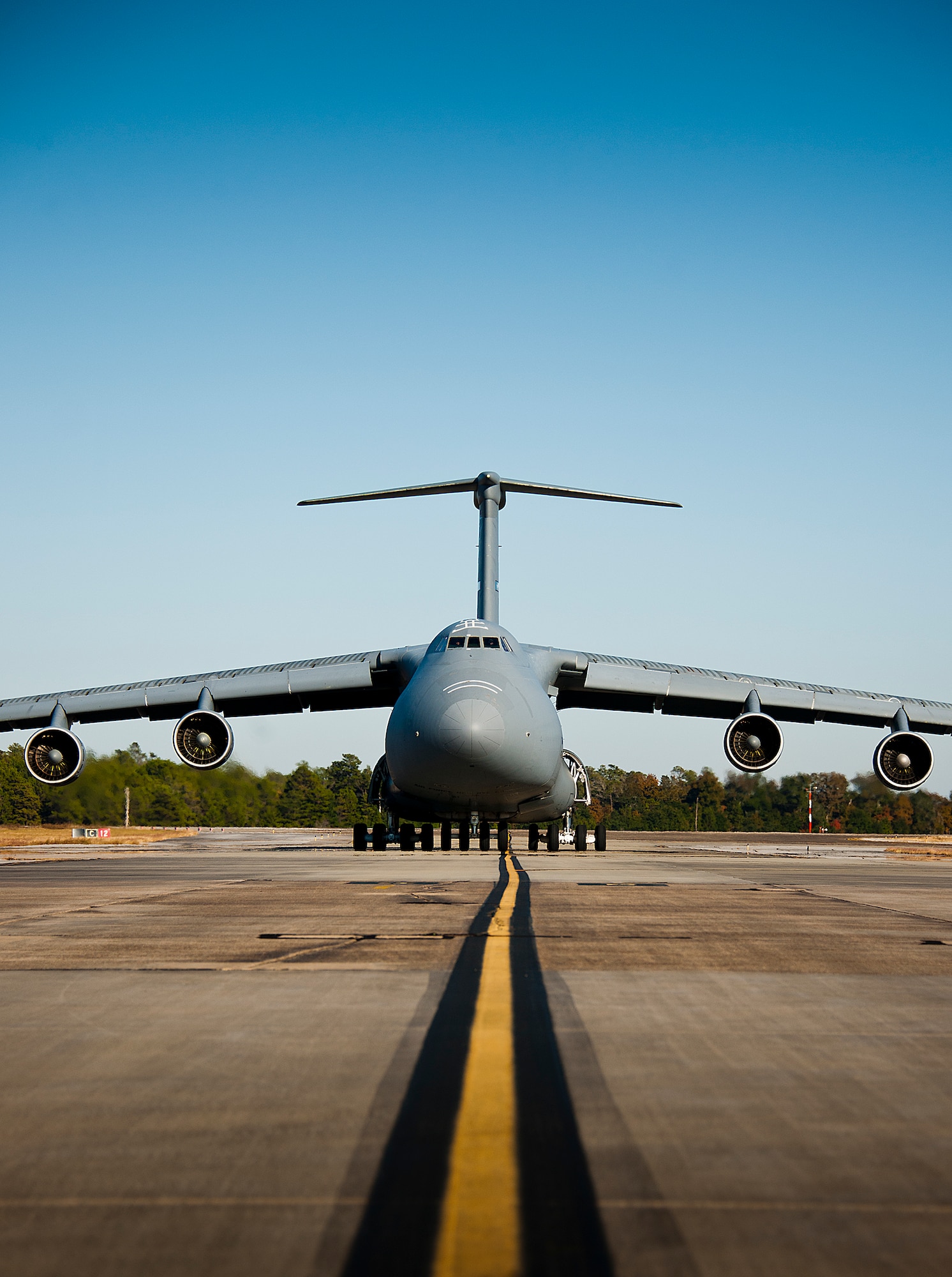 A 433rd Airlift Wing C-5 Galaxy from Joint Base San Antonio arrives with passengers and equipment to Eglin Air Force Base, Fla. Nov. 14.  The reserve aircrew brought home Soldiers and equipment from the Army’s 7th Special Forces Group.  (U.S. Air Force photo/Samuel King Jr.)