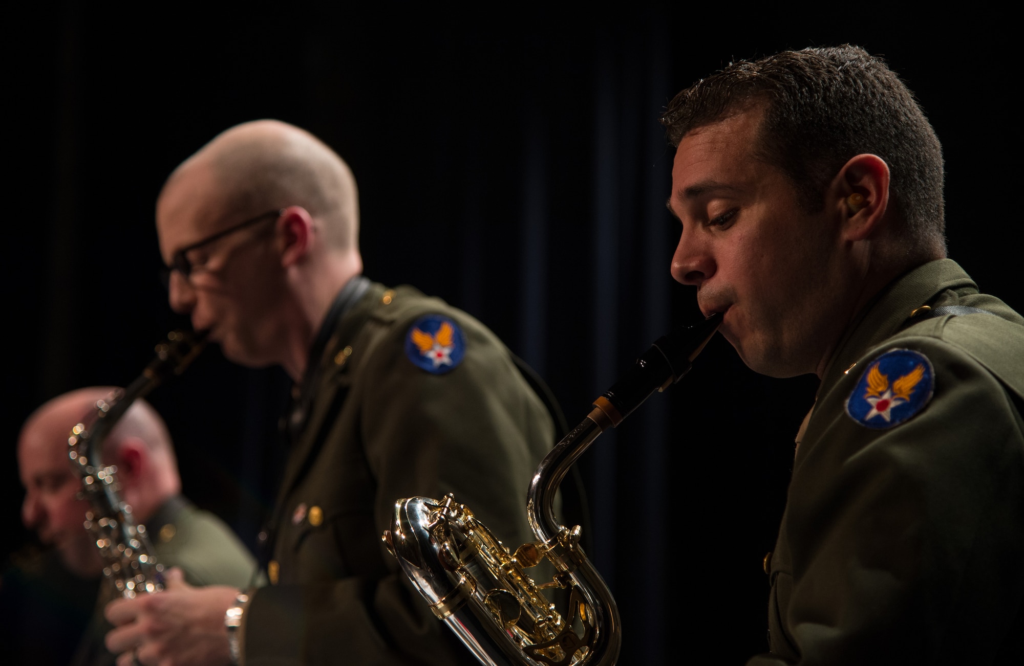 Staff Sgt. Lencys Esteban-Nunez, regional saxophonist for the U.S. Air Forces in Europe Band, plays a song during a Battle of the Bulge 70th anniversary commemoration event, Nov. 22, 2014, in Bastogne, Belgium. The USAFE Band played throughout Europe since September stopping at villages that were affected by the battle. The band featured approximately 20 songs from the 1940s, bringing joy and nostalgia to the audience. (U.S. Air Force photo/Senior Airman Jonathan Stefanko)