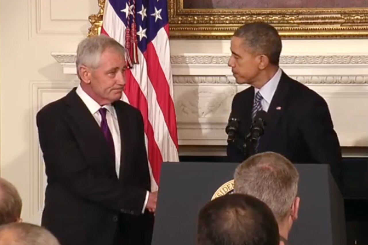 Defense Secretary Chuck Hagel shakes hands with President Barack Obama at the White House today. The president announced that Hagel would resign his position as defense secretary. Courtesy photo