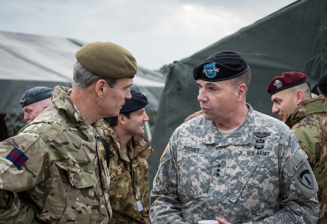 Army Lt. Gen. Ben Hodges, right, commanding general, U.S. Army Europe, talks with Maj. Gen. Sir George Norton, deputy commander, NATO Rapid Deployable Corps Italy, at the Distinguished Visitor Day visit to Exercise ARRCADE Fusion, Nov. 20, 2014. NATO photo by British Army Warrant Officer 2 Ian Houlding
