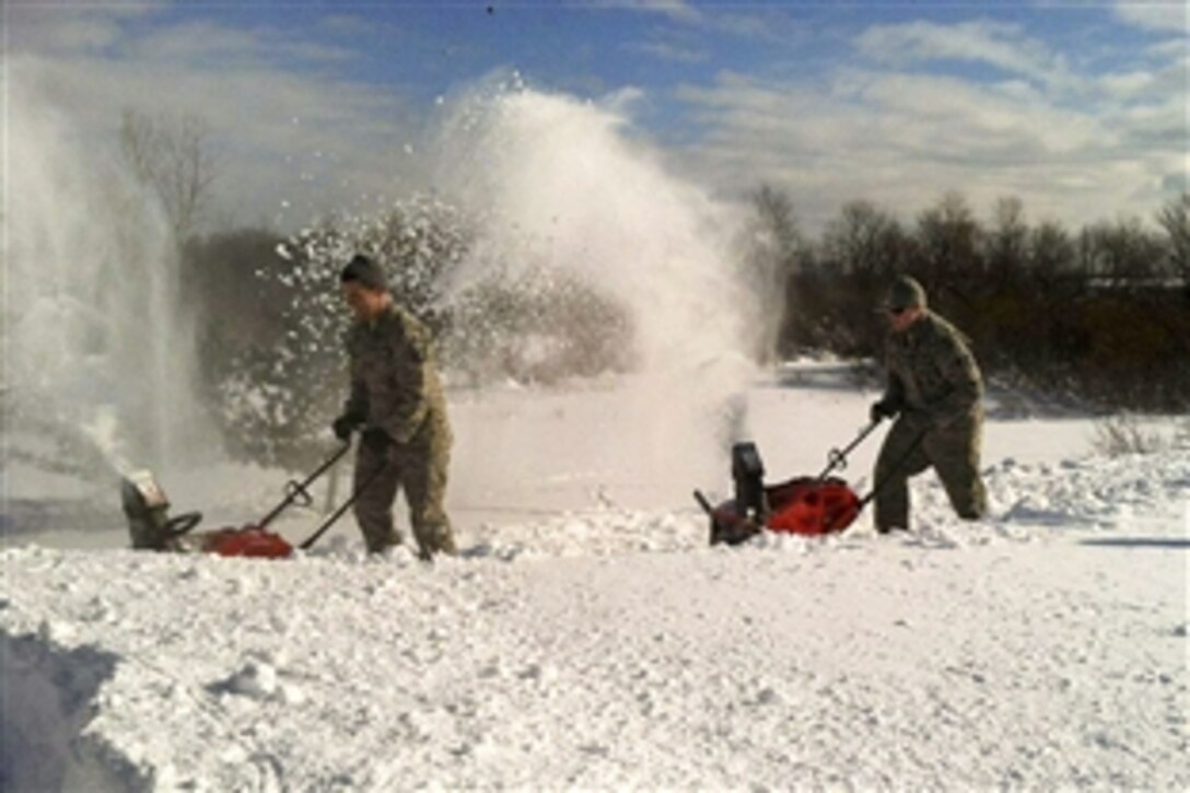National Guard airmen use snow blowers to remove snow from the roof of the Eden Heights Nursing Home in West Seneca, N.Y., Nov. 21, 2014. New York Gov. Andrew M. Cuomo called up about 375 Guardsmen to support response and recovery efforts following historic amounts of snowfall in the area. The airmen are assigned to the New York Air National Guard's 107th Airlift Wing.