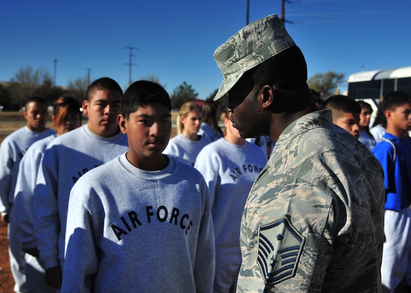 U.S. Air Force Master Sgt. Marvin Jimerson, 27th Special Operations Maintenance Squadron first sergeant and former basic military training technical instructor, puts cadets at attention Nov. 21, 2014 upon their arrival at Cannon Air Force Base, N.M. Junior Reserve Officer Training Corps cadets with Clovis, New Mexico high school were mentally and physically tested by an elite core of Air Commandos as part of a growing partnership with Cannon’s local community. (U.S. Air Force photo/Staff Sgt. Alexxis Mercer)