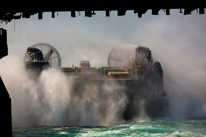 A Landing Craft Air Cushion (LCAC) performs an at-sea-boarding onto the USS Kearsarge (LHD3) during Exercise Bold Alligator 14, Oct. 31, 2014. Exercise Bold Alligator 14 is a multi-national, synthetic naval exercise designed to train the full range of amphibious capabilities in order to provide unique and contemporary solutions to global challenges. (U.S. Marine Corps photo by Lance Cpl. Tanner Casares/Released)