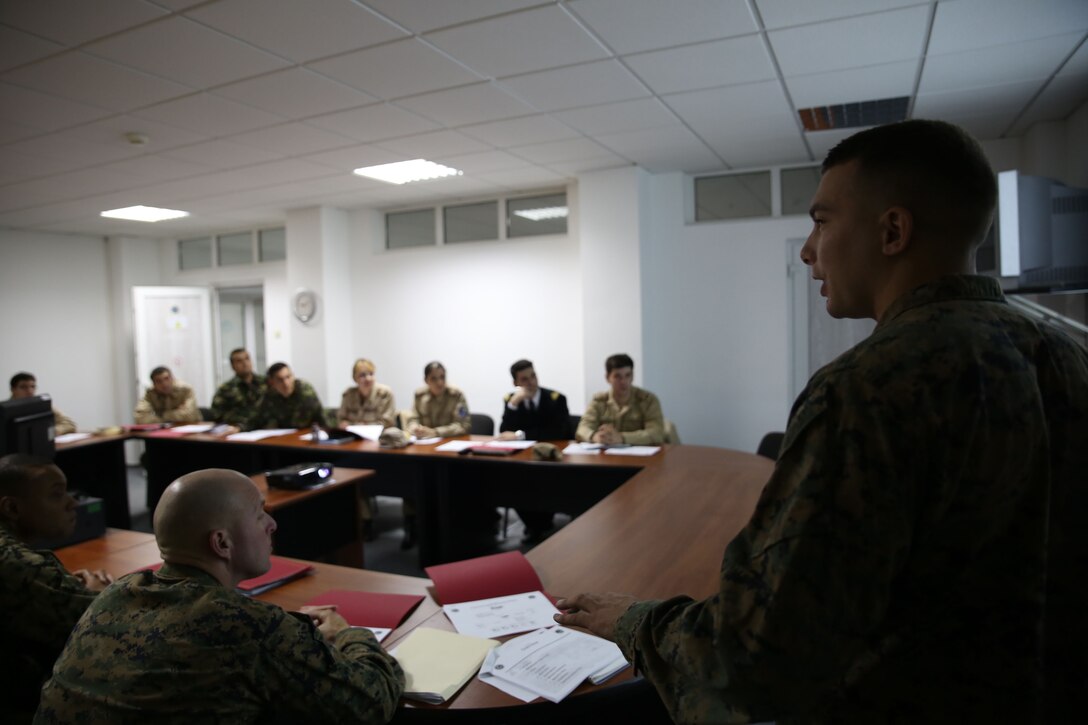 1st Lt. Julian D’orsaneo (right) begins his class on in-depth communications planning. Communications Marines from Black Sea Rotational Force held a two-day military-to-military training exercise Nov. 12-13 in Constanta, Romania with members of the Romanian Armed Forces to discuss communication tactics, techniques, and procedures.